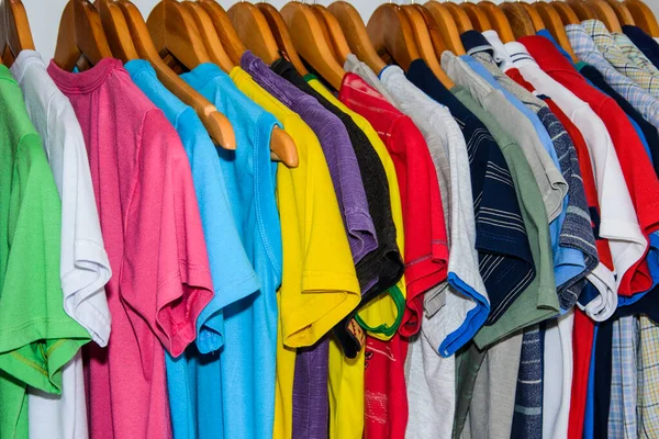 Lots of colored shirts on the hanger tidy and washed for use. Salvador Bahia Brazil.