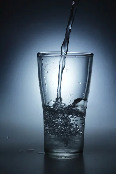 Pouring water into glass — Stock Photo, Image