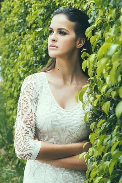 Looking at the horizon, lacy dress, forest, professional photography, elegant woman,flower background.