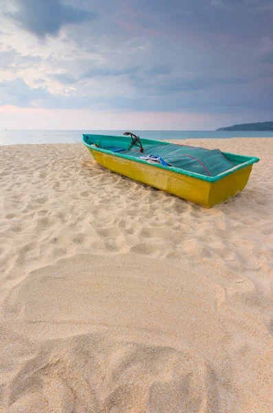 Small boat on the beach with sand sign for writing Stock Image