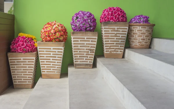 Pot of flowers at the stairs — Stock Photo, Image