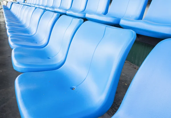 Empty blue seats or chair rows in stadium — Stock Photo, Image