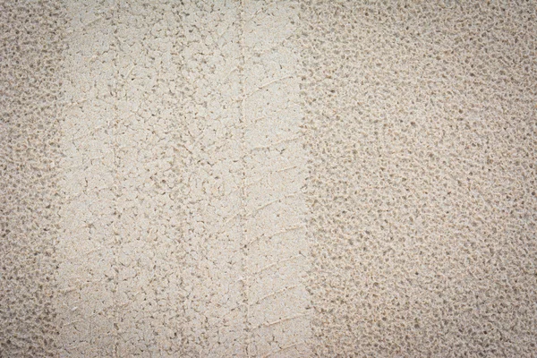 Gumiabroncs-számokat a homok háttér — Stock Fotó