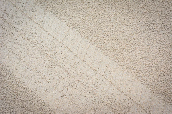 Gumiabroncs-számokat a homok háttér — Stock Fotó
