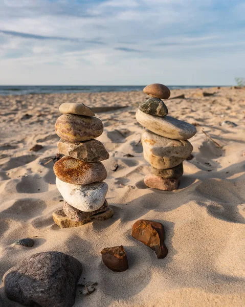 Zen meditation background - balanced stones stack close up on sea beach. hormones and balance. finding yourself