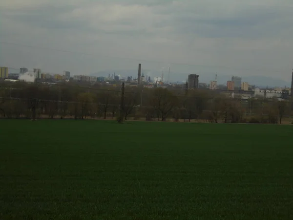 Urban Panorama Meadow Foreground Split Image Industrial City Bordering Natural — Stock Photo, Image