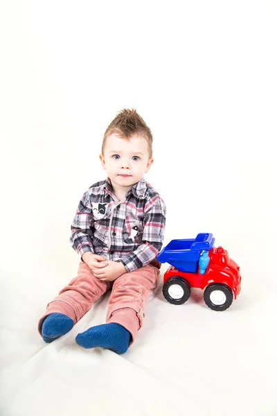 Baby boy pay with car — Stock Photo, Image