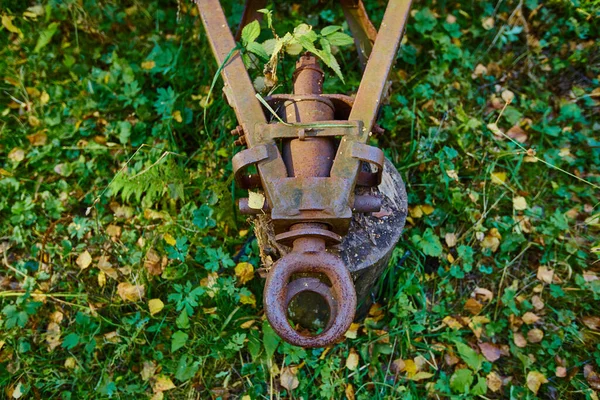 Old and rusty tractor trailer hitch.