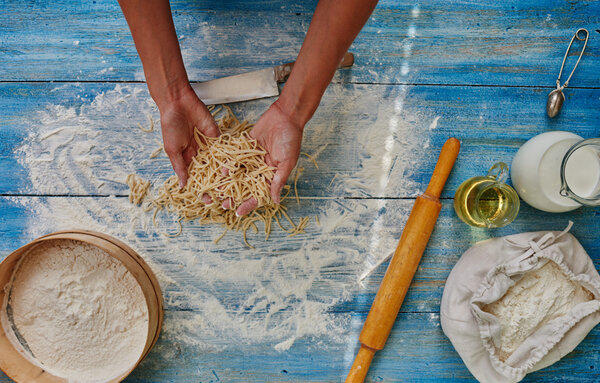 Cook woman preparing Italian pasta
