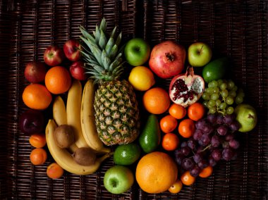 There are fruits on the rattan table
