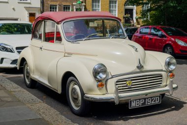 London - 06 25 2022: Vintage convertible car parked in Kensington Square