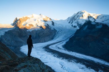 Enjoying the last sunlight on the Monte Rosa mountain massif. Gornergrat, Zermatt, Switzerland.
