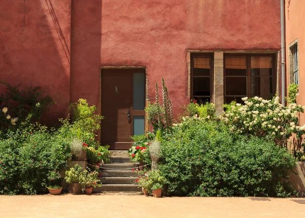 Colorful, old building and garden in Vieux-Lyon, the old city center of Lyon, France.