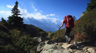 A man hiking on the famous Tour du Mont Blanc near Chamonix, France.
