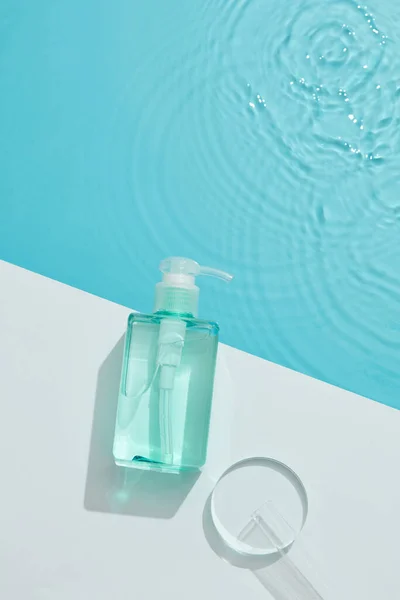 Blue Cosmetic Bottle White Square Podium Blue Water Surface Test — Stock Photo, Image