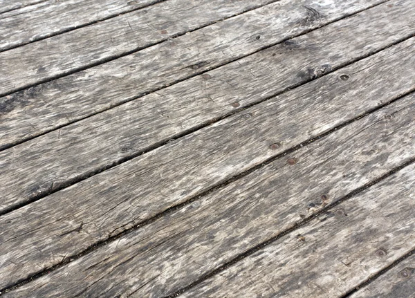 Yıpranmış gri ahşap zemin. 