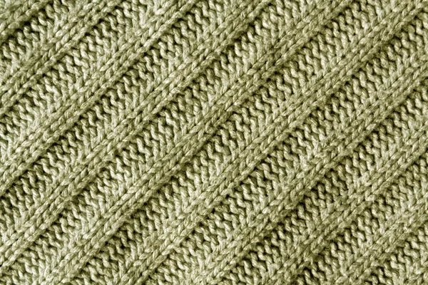 Abstract beige knitted cloth texture.