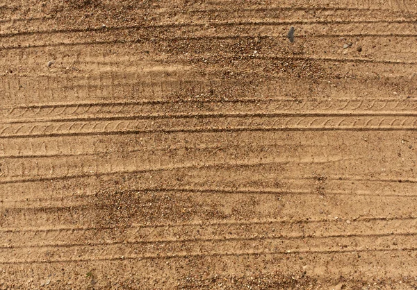 Abstrakt hjulspår på sand. — Stockfoto