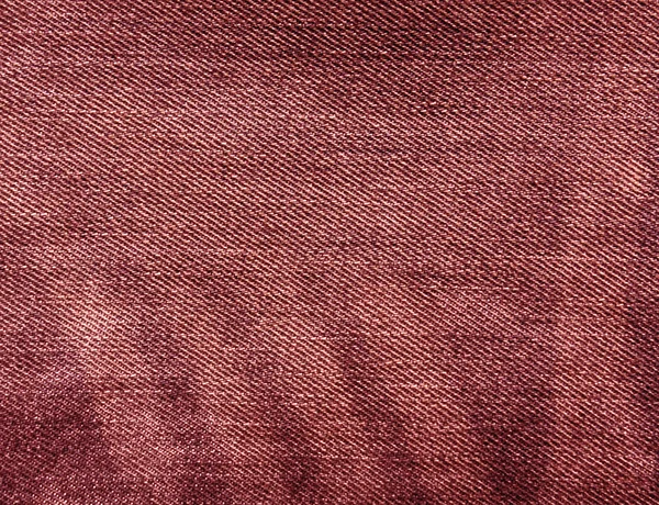 Абстрактная текстура джинсов красного цвета . — стоковое фото