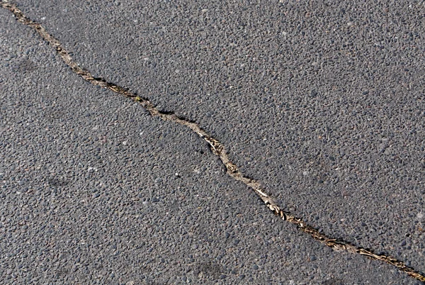 Pęknięty kolor nawierzchni asfaltowej. — Zdjęcie stockowe