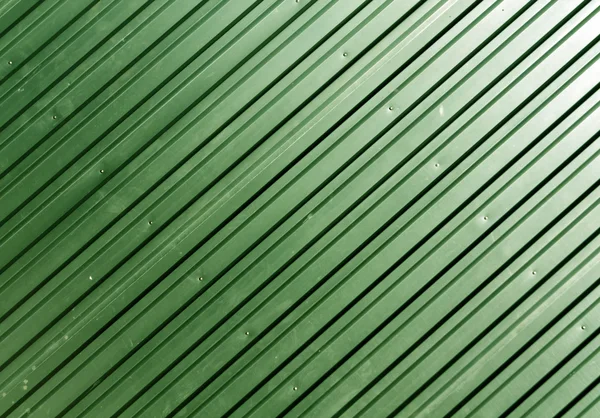 Green metal plate surface.