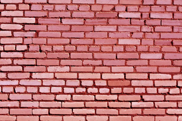 Väderbiten röd tonas tegel vägg textur. — Stockfoto