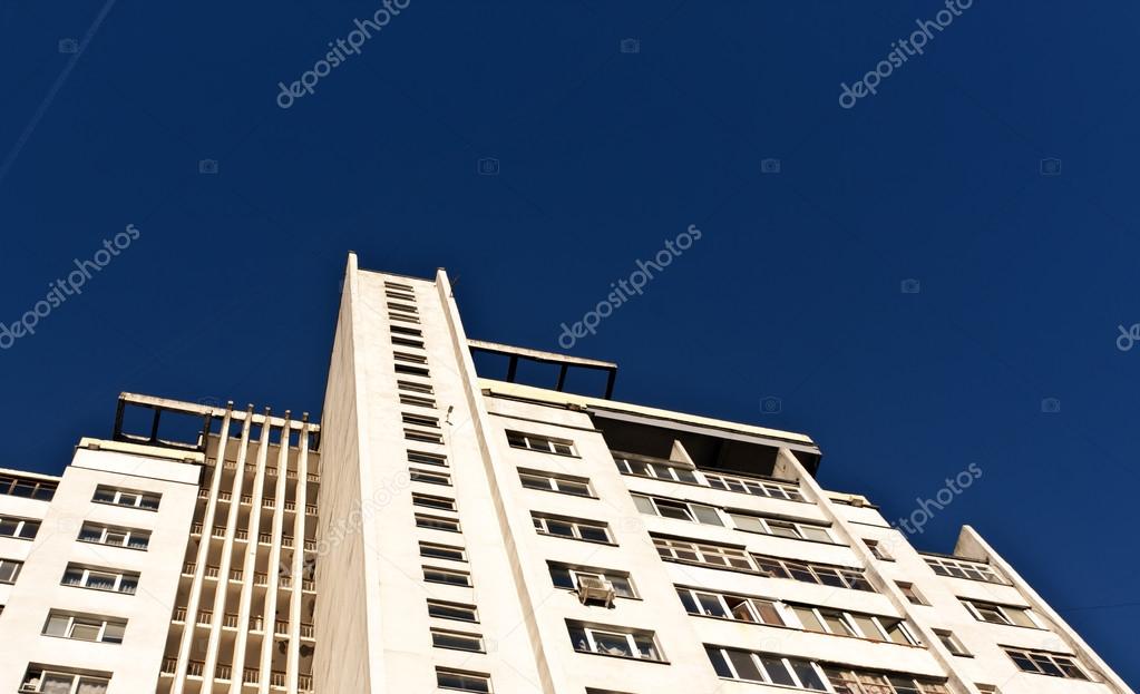 Residential building against blue sky with plase for your text.