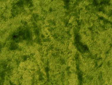 Yeşil kumaş yüzeyi.