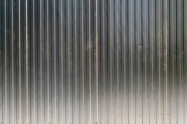 Grey color metal sheet fence texture. Architectural and construction background