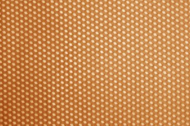 Honeycomb cells pattern in orange tone. Abstract architectural background and texture for design.