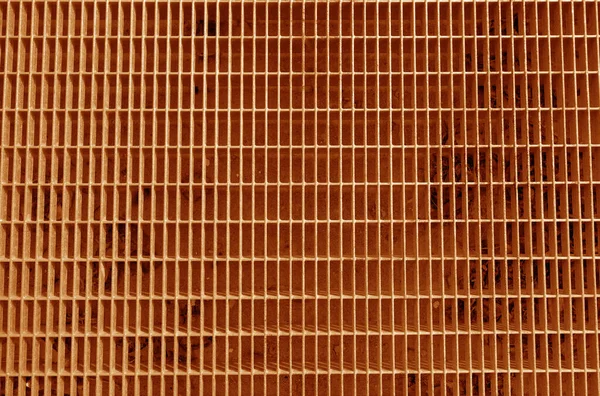 オレンジ色のトーンで金属グリッドパターン 要旨建築的背景とデザインの質感 — ストック写真