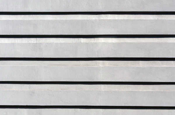Graue Farbe stilisierten Gips Wand Textur. — Stockfoto
