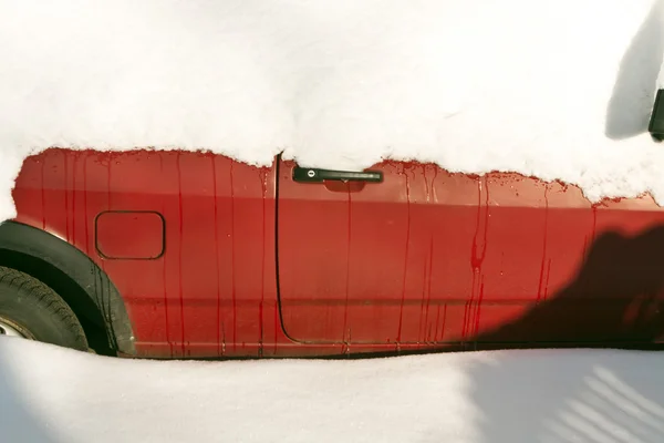 Red car under snow. — Stock Photo, Image
