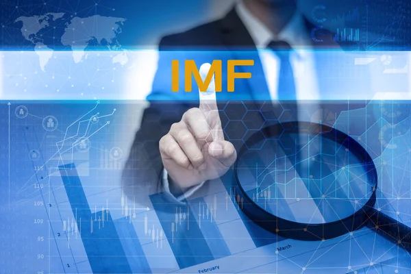 商人用手抚摸国际货币基金组织在虚拟屏幕上的按钮 — 图库照片