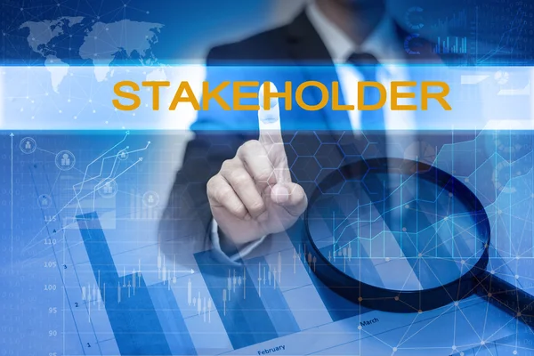 Empresario mano tocando el botón STAKEHOLDER en la pantalla virtual — Foto de Stock