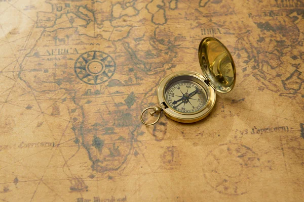 Old compass on vintage map Stock Photo