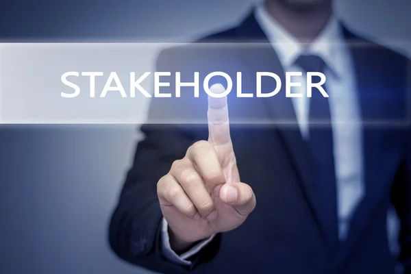 Imprenditore mano toccando Pulsante STAKEHOLDER sullo schermo virtuale — Foto Stock