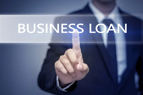 Бізнесмен торкається кнопки BUSINESS LOAN у віртуальному сценарії — стокове фото