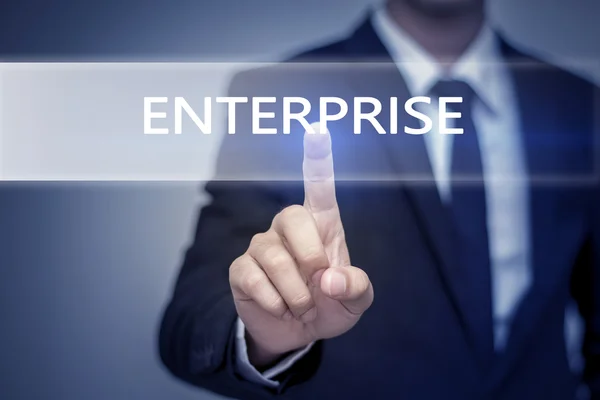 Biznesmen rękę dotykając przycisk Enterprise na wirtualny ekran — Zdjęcie stockowe