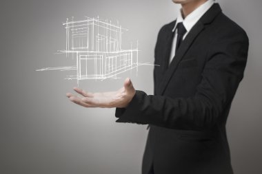 Evin bir model gösterilen işadamı