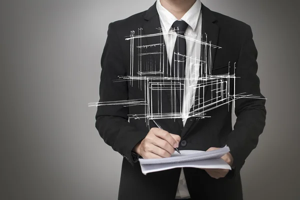 Empresário desenhando um modelo da casa — Fotografia de Stock