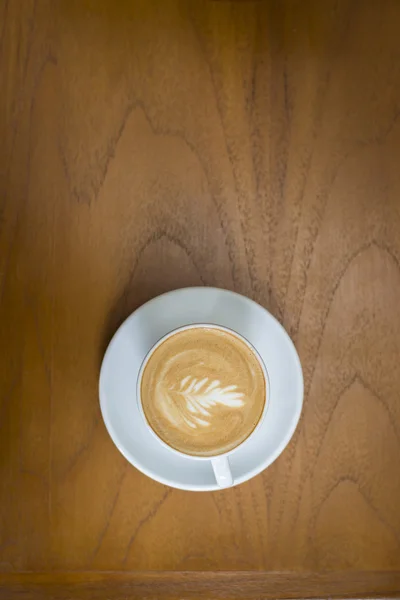 Cappuccino-Tasse auf Holz-Hintergrund — Stockfoto