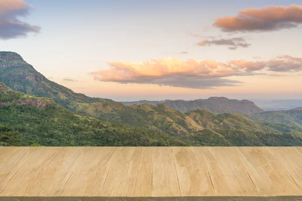 Wood floor with background of mountain view at twilight — Stock Photo, Image