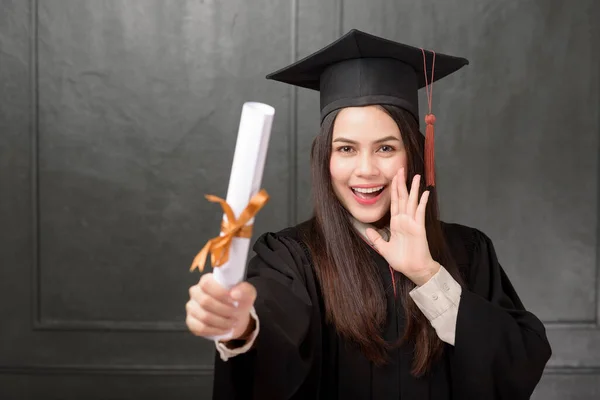 Portrait Young Woman Graduation Gown Smiling Cheering Black Background — Stock Photo, Image
