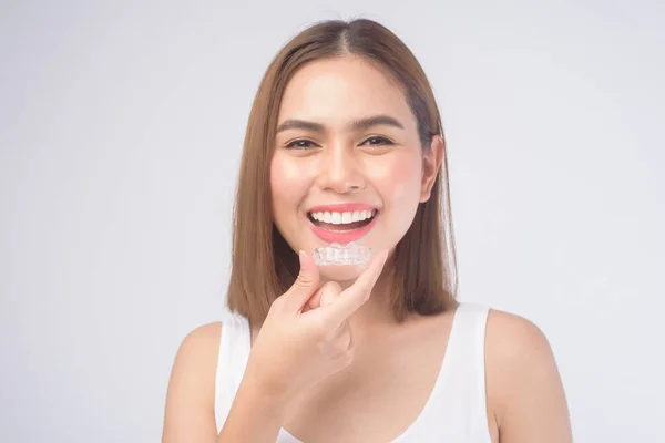 Young Smiling Woman Holding Invisalign Braces White Background Studio Dental — Stock Photo, Image