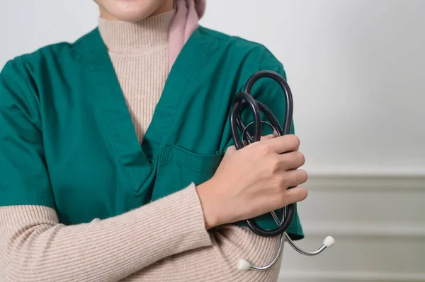 A portrait of Female muslim doctor with stethoscope at office.