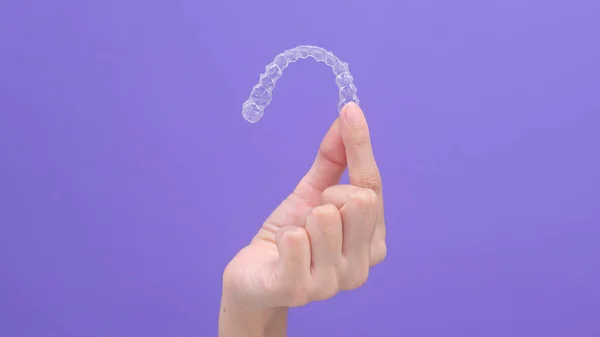 Close Woman Hand Holding Invisalign Braces Studio Dental Healthcare Orthodontic — Φωτογραφία Αρχείου