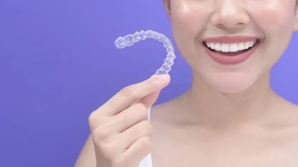 Young Smiling Woman Holding Invisalign Braces Studio Dental Healthcare Orthodontic — Stok fotoğraf