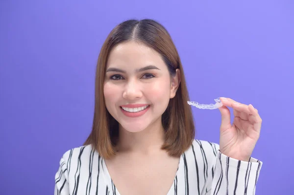 Young Smiling Woman Holding Invisalign Braces Studio Dental Healthcare Orthodontic — 图库照片