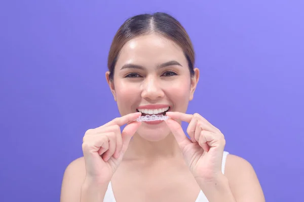 Young Smiling Woman Holding Invisalign Braces Studio Dental Healthcare Orthodontic — Zdjęcie stockowe